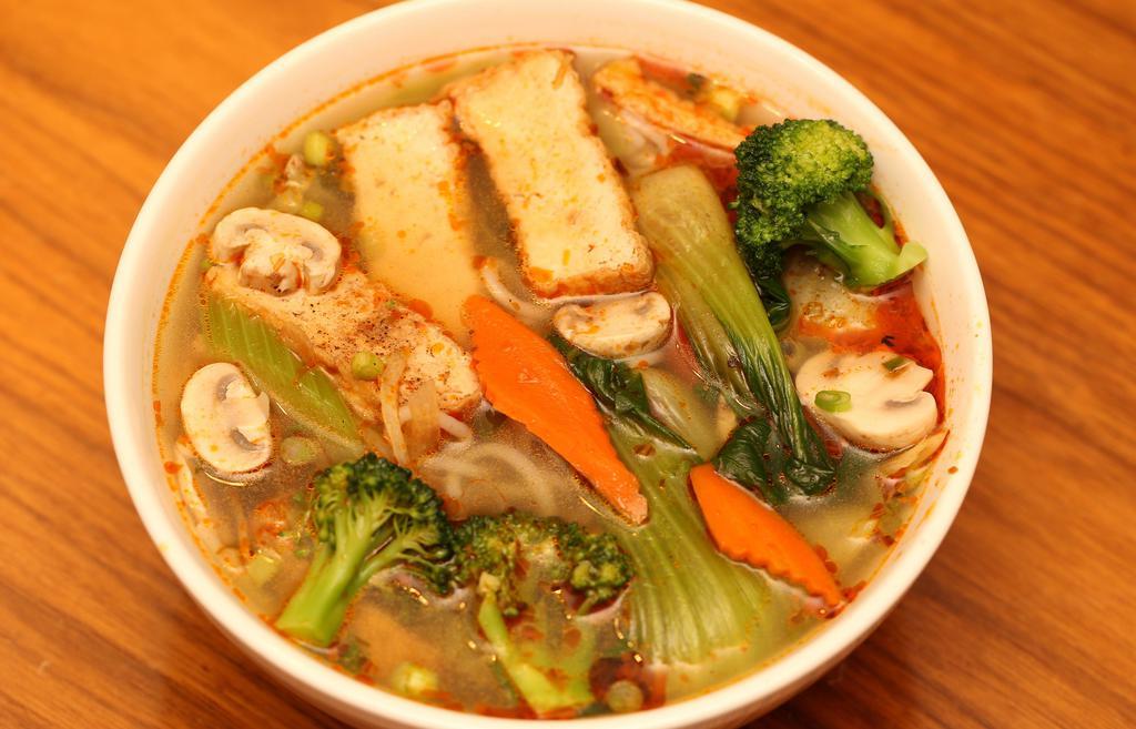 Vegetarian Spicy Soup · Spicy. Vegetable Soup with Tofu, thick rice noodles, and vegetables: broccoli, mushroom, carrot, cabbage, celery, bok choy