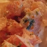 Blow Blow · House crab, cucumber, avocado, topped with seasoned creamy tomato mix, seaweed, furikake, al...
