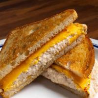 Tuna Melt · Tuna salad and cheddar cheese hot pressed on sourdough. Made with wild, line caught tuna.