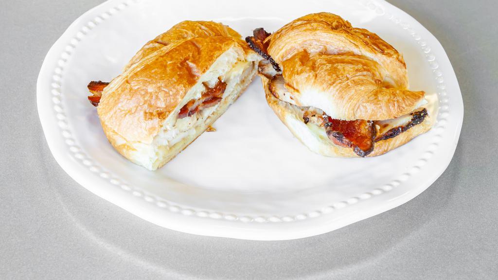 Brie-Ing Down The House · Sliced roasted turkey, bacon, brie cheese, pepper jelly, mayo on a toasted croissant.
