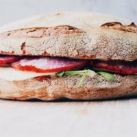 The Mob Rules Sandwich · Italian sub with mortadella, ham, salami, provolone cheese, tomatoes, lettuce, Italian peppe...