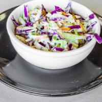 Jalapeño Coleslaw · Coleslaw tossed with our house-made jalapeño dressing.