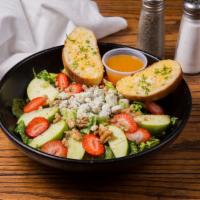 Apple Walnut Salad · Romaine, granny smith apples, strawberries, candied walnuts, bleu cheese crumbles tossed wit...