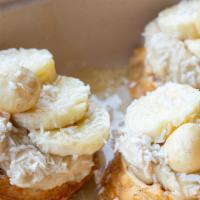 Banana Nut · Sweet cinnamon waffles topped with house made vegan cashew cream, bananas, macadamia nuts, c...