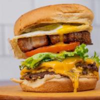 Midnight Burger · Double patty burger with Velveeta cheese, brown mustard aioli, pickle on a toasted bun.