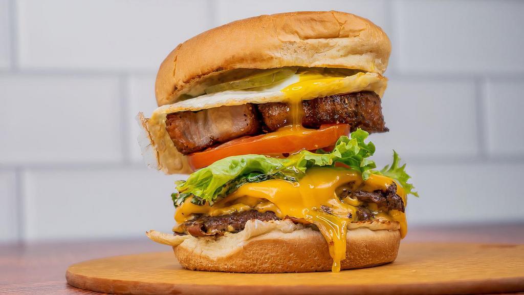 Midnight Burger · Double patty burger with Velveeta cheese, brown mustard aioli, pickle on a toasted bun.