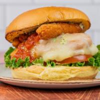 Parm Chicken Sandwich		 · Crispy chicken piled high with mozzarella sticks, pesto aioli, lettuce, tomato