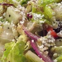 Traditional Greek Salad · Romaine lettuce, tomatoes, red onion, cucumbers, pepperoncini, kalamata olives, and feta che...
