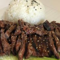 Teriyaki Beef · Served with rice, tempura vegetables, and gyoza.
