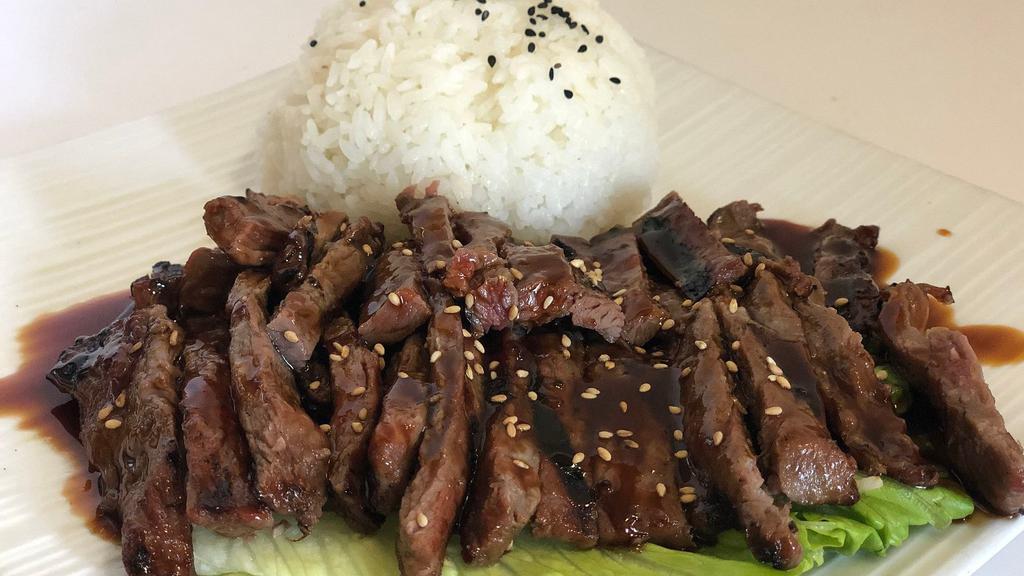 Teriyaki Plate · Your choice of marinated chicken, beef, or salmon for an extra charge. Served with a side of rice. Includes a side salad and miso soup.