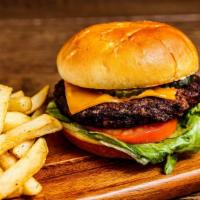 Main Land Burger · Grilled beef patty, American, tomato, lettuce, and pickle served on a toasted bun served wit...