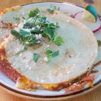 Quesadilla · Choice of flour or our hand pressed corn tortillas filled with cheddar- jack cotija cheese m...