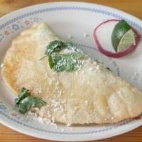 Dilla · It's our version of an empanada. Filling of your choice smothered in a drunken sauce, cotija...