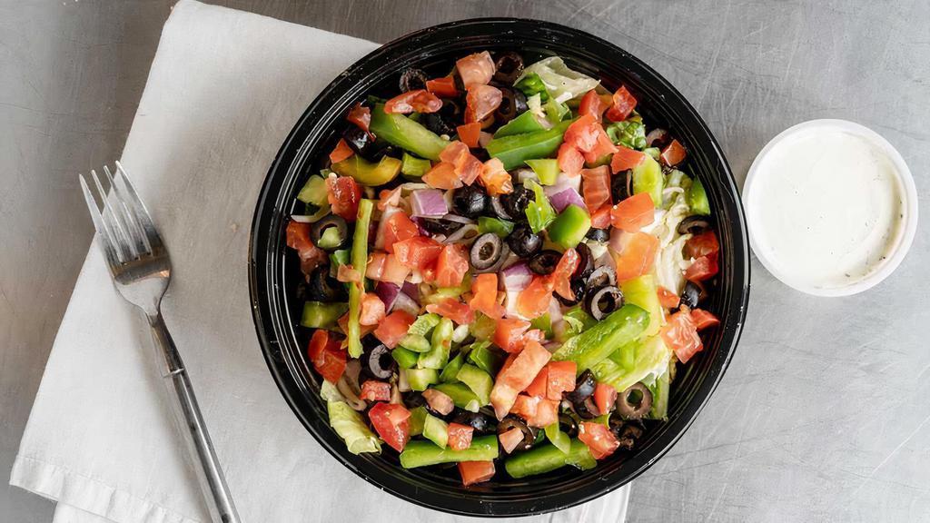 Garden Salad · Made fresh with a blend of crispy iceberg and romaine lettuce, topped with red onions, green peppers, tomatoes, black olives and shredded mozzarella cheese.