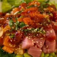 Salmon & Tuna Poke · Sesame & soy marinated salmon and tuna mixed with rice, mixed greens, assorted veggies. Spic...