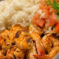 Grilled Shrimp · grilled shrimp served with Spanish rice and pico de gallo for freshness.