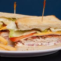 Mvp Club · Thin sliced turkey, ham, bacon, lettuce, tomato, American and Swiss cheese and mayo in betwe...