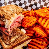 Reuben Sandwich · Thinly sliced pastrami, melted Swiss cheese, sauerkraut, Russian dressing between slices of ...