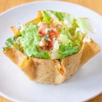 Taco Salad · Crispy shell, choice of meat or veggies, black or pinto beans, Spanish rice, white cabbage, ...