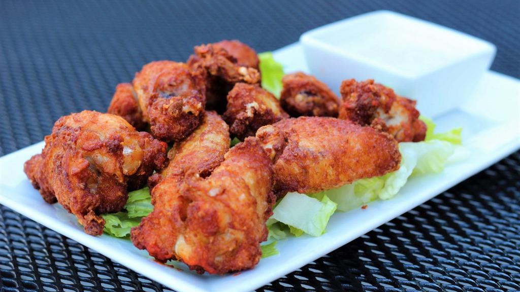 Bone-In Wings · Crispy chicken joints, fried & lightly seasoned. Choose your sauce. Chunky bleu cheese dressing.