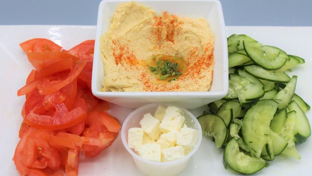 Hummus Platter · Our authentic Lebanese garbanzo blend, toasted flatbread, feta crumbles, tomato and cucumbers.
