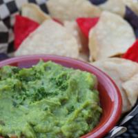 Chips & Guac · Hand-mashed chunky and zesty guacamole. Warm house tortilla chips.