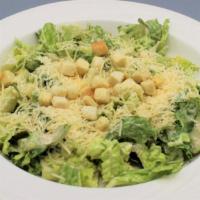 Caesar Salad · Green romaine lettuce, rich caesar dressing, shredded parmesan and garlic croutons.