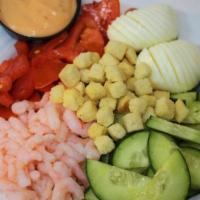 Shrimp Louie · Juicy bay shrimp, chopped tomato and cucumber, hard-boiled eggs, romaine lettuce, garlic cro...