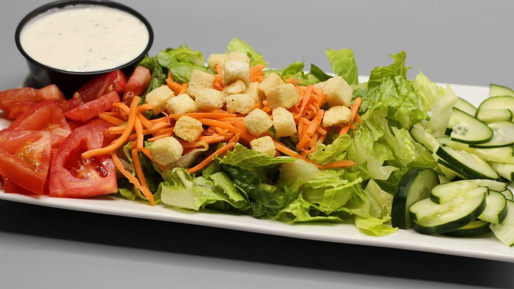 House Salad · Fresh chopped romaine lettuce, tomato and cucumber. Topped with shredded carrots and garlic croutons. Choice of dressing.
