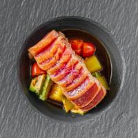 Tuna Tataki* · Sesame seared big eye tuna served with orange salsa and  ponzu. Consumption of uncooked meat...
