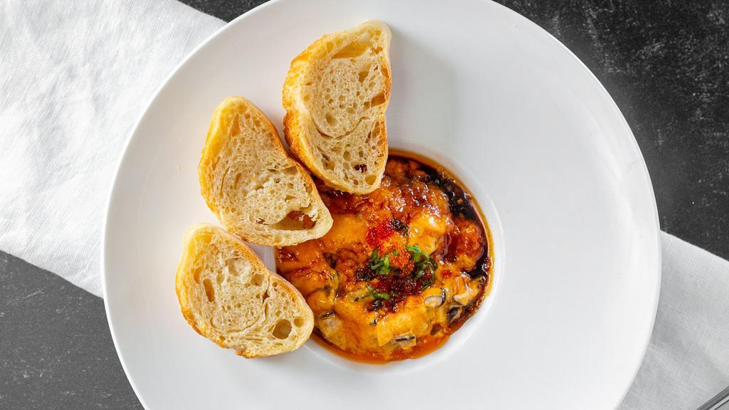Baked Mussels · New Zealand Mussels mixed in eel sauce, scallions and tobiko. Served with baguette.