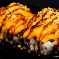 Volcano Roll · Oven cooked phily roll, topped with spicy crab mix, spicy mayo, eel sauce, crunch