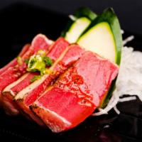 Seared Tuna Sashimi · This item may contain raw or undercooked ingredients or may be cooked to order. Consuming ra...