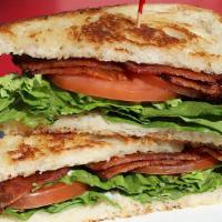 Grilled Blt · Bacon, lettuce, tomato, and mayonnaise on rustic white bread