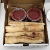 Seasoned Breadsticks (8) · Our breadsticks are buttered, seasoned and baked to perfection. Served with 2 large sides of...
