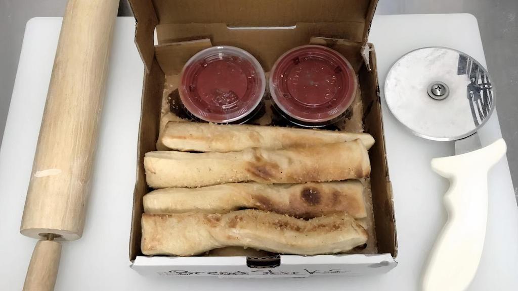 Seasoned Breadsticks (8) · Our breadsticks are buttered, seasoned and baked to perfection. Served with 2 large sides of marinara.