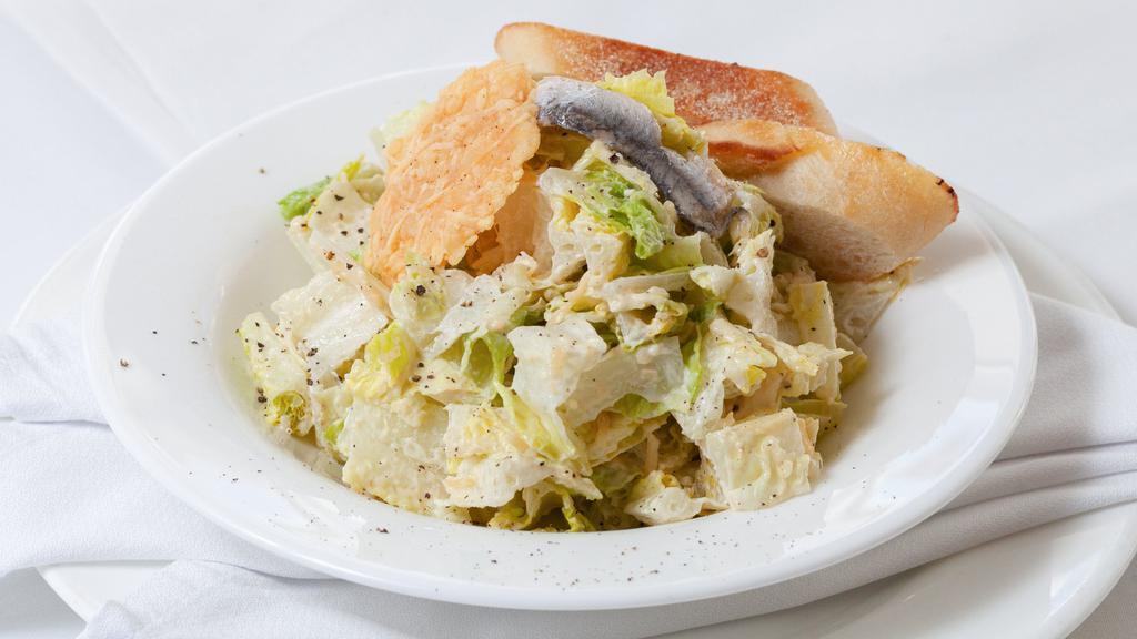 Grilled Chicken Caesar · Classic Caesar with fresh romaine, parmesan cheese & grilled chicken tossed in Caesar dressing.