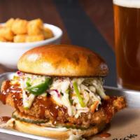 Red Rocks Hot Chicken · Buttermilk fried chicken coated in Nashville hot sauce, apple jalapeno slaw, pickles and may...