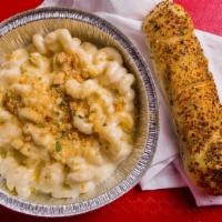 Mac N Cheese · Large portion of white cheddar Mac n Cheese. We put breadcrumbs and extra cheese on top upon...