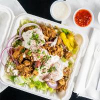 Chicken Shawarma Salad · Served on Greek salad with tzatziki.