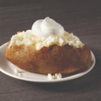 Baked Potato · A generous sized potato cooked to fluffy perfection and then served with butter and sour cre...