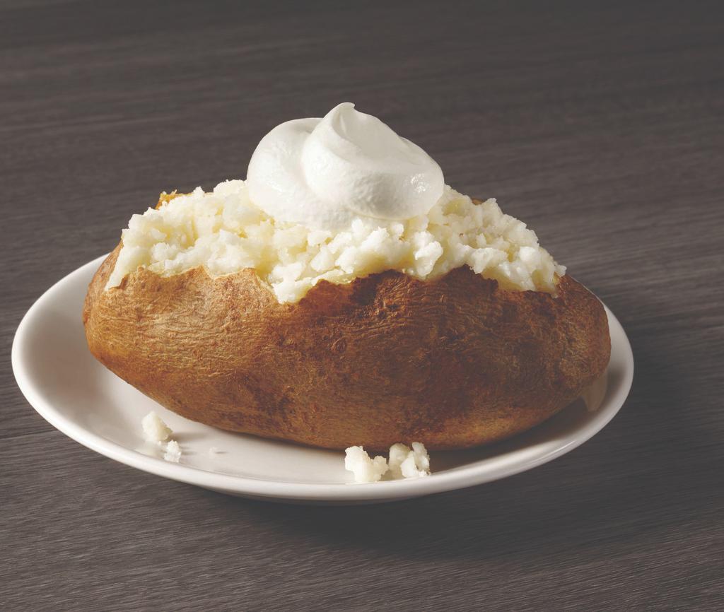 Baked Potato · A generous sized potato cooked to fluffy perfection and then served with butter and sour cream.