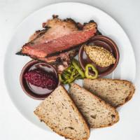 House Smoked Pastrami Plate · slices of house smoked pastrami. horseradish beets. bourbon pickled Anaheim peppers. stone g...