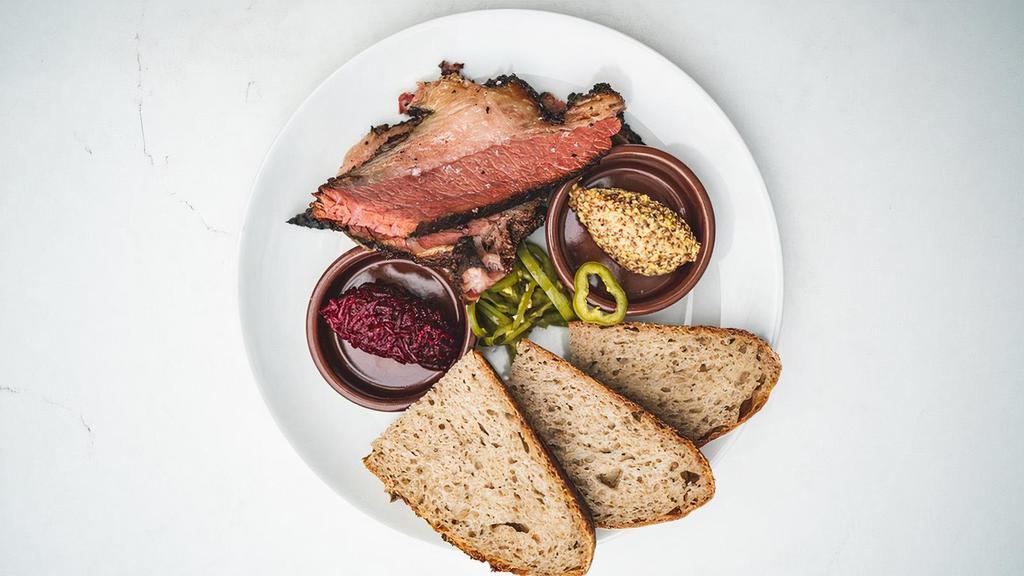 House Smoked Pastrami Plate · slices of house smoked pastrami. horseradish beets. bourbon pickled Anaheim peppers. stone ground. house made rye