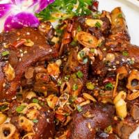 Hot & Spicy Pig'S Trotters / 香辣美容蹄 · Slow braised, finished with roasted peanuts sautéed with house hot and spicy seasoning.