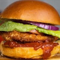 Spiced Up Fried Chicken Sandwich · Hot stuff. Crispy fried chicken, sliced tomatoes, shredded lettuce, and hot sauce.