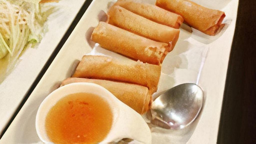 Egg Rolls · Mixed vegetables, glass noodle wrapped with spring roll wrap, deep fried served with sweet and sour sauce.