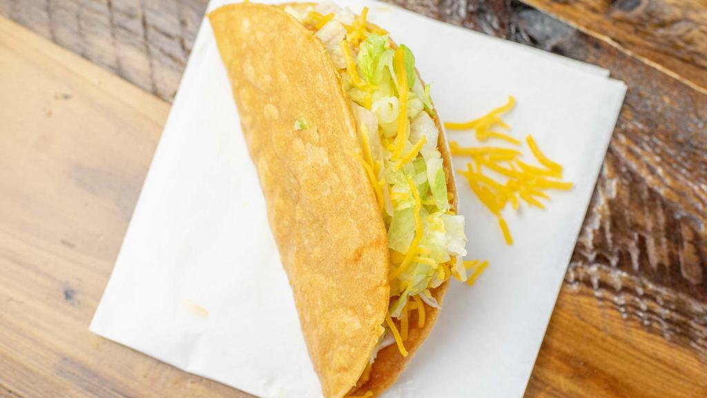 Chicken Taco · Hardshell chicken taco with lettuce and cheese.