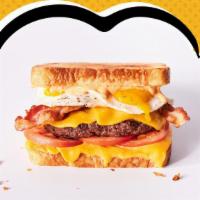 Rise N Shine Melt · Hamburger patty, American cheese, 2 fried eggs*, bacon, tomatoes & Awesome Sauce