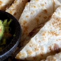Quesadilla · Flour tortillas layered with roasted sliced chile poblanos, mushrooms and Monterey Jack chee...